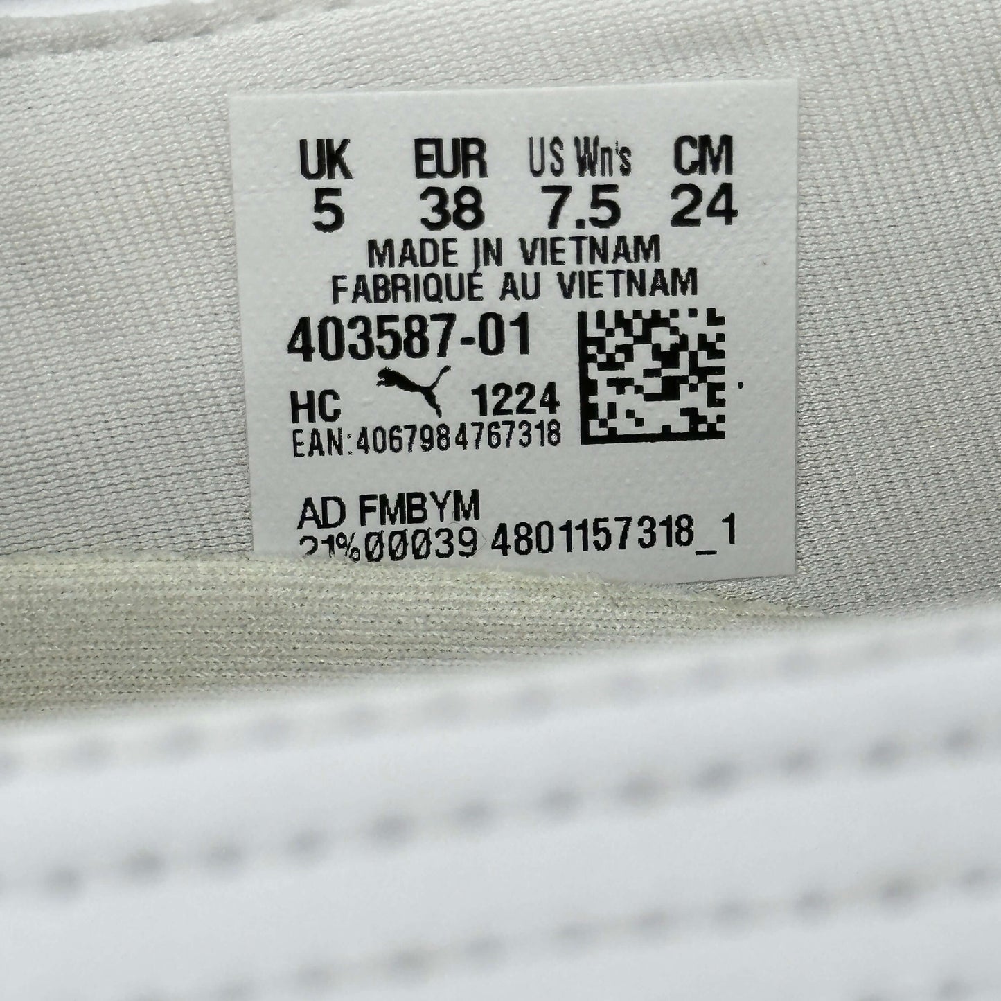 Puma speedcat ballet flats tag displaying size 5 UK, 38 EUR, 7.5 US in sustainable packaging.