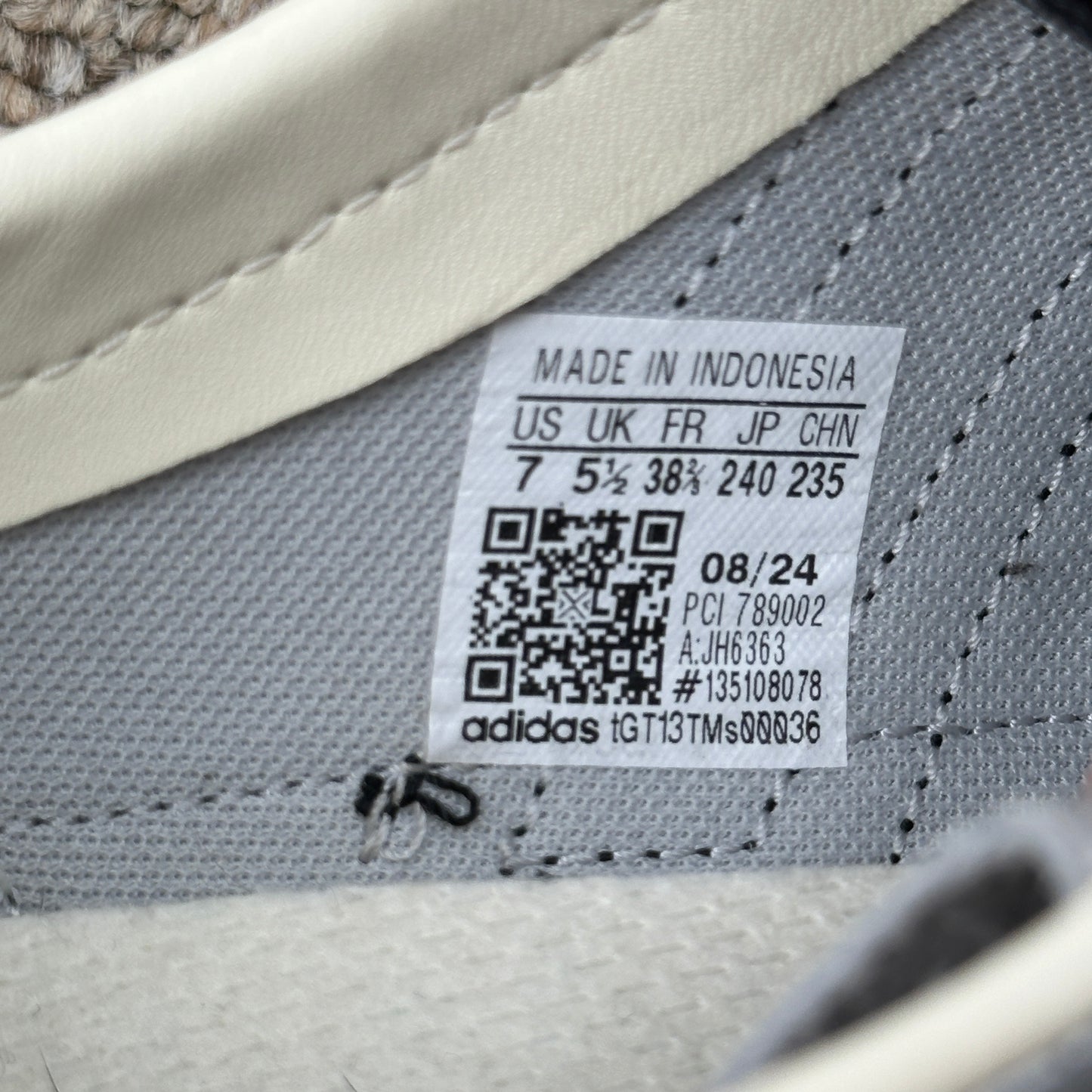 Adidas SL 72 OG size label details for preloved sustainable trainers in metallic silver and black.