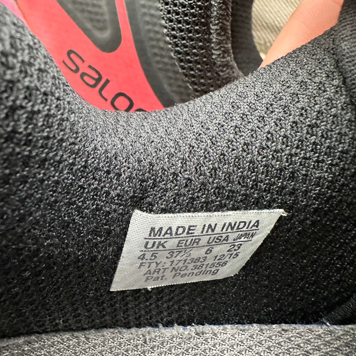 Salomon XT wings pro 2 label showing size 4.5 UK, made in India, sustainable second hand trainers.